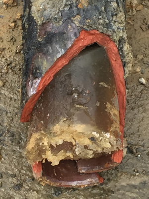 Sewer pipe filled with hardened grease
